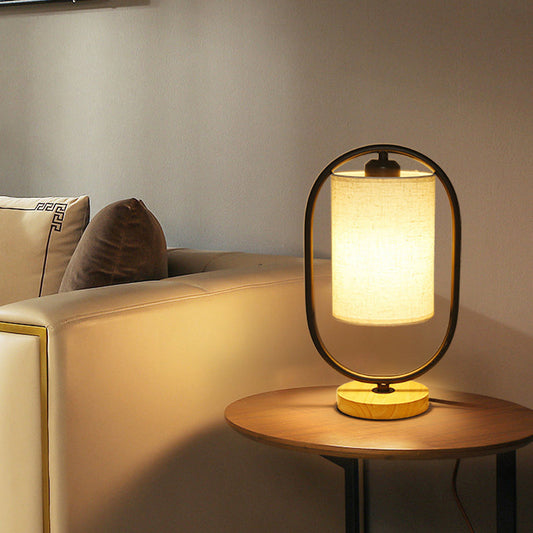 Contemporary Scandinavian Oval Cylinder Solid Wood Metal Fabric 1-Light Table Lamp For Bedroom