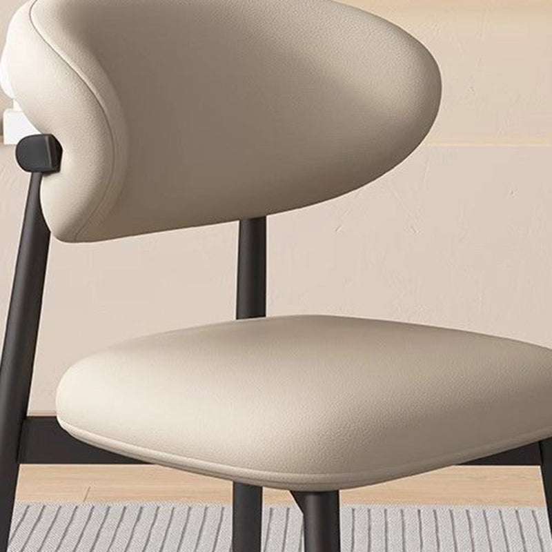 Modern Minimalist Curved PU Leather Carbon Steel Dining Chair Backrest Armless For Dining Room