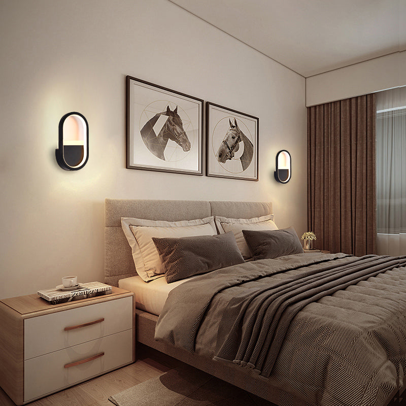 مصباح حائط LED دائري بيضاوي الشكل مصنوع من الحديد والسيليكون بتصميم عصري بسيط لغرفة النوم 