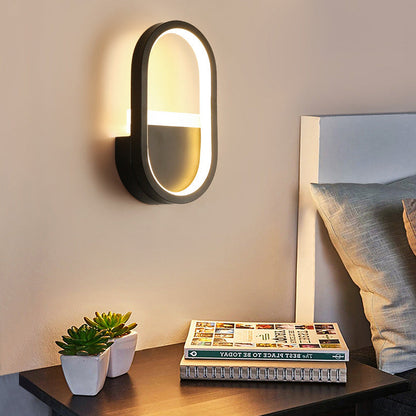 مصباح حائط LED دائري بيضاوي الشكل مصنوع من الحديد والسيليكون بتصميم عصري بسيط لغرفة النوم 