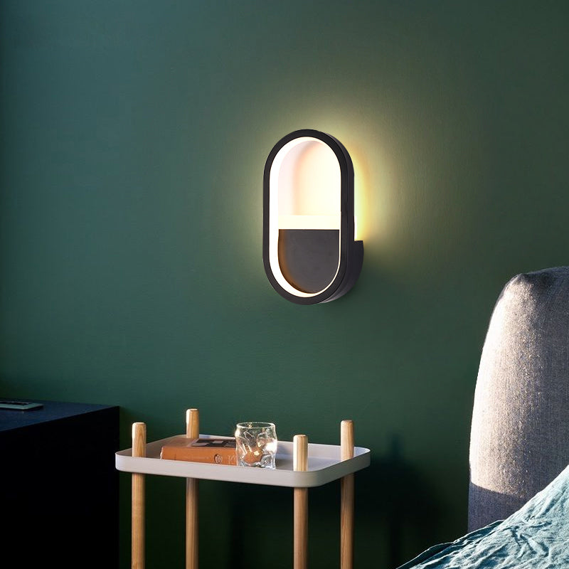 مصباح حائط LED دائري بيضاوي الشكل مصنوع من الحديد والسيليكون بتصميم عصري بسيط لغرفة النوم 