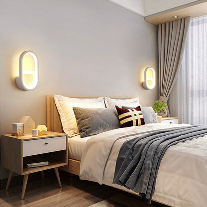 مصباح حائط LED دائري بيضاوي الشكل مصنوع من الحديد والسيليكون بتصميم عصري بسيط لغرفة النوم 