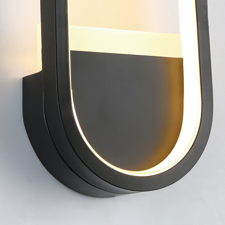 مصباح حائط LED دائري بيضاوي الشكل مصنوع من الحديد والسيليكون بتصميم عصري بسيط لغرفة النوم 