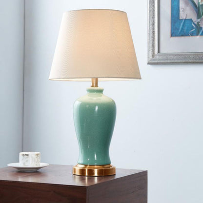 Contemporary Nordic Ceramic Fabric Elliptical Base 1-Light Table Lamp For Bedroom And Living Room
