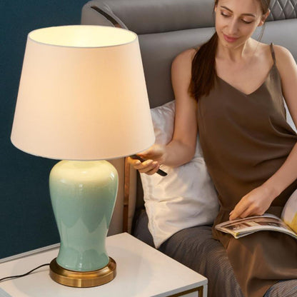 Contemporary Nordic Ceramic Fabric Elliptical Base 1-Light Table Lamp For Bedroom And Living Room