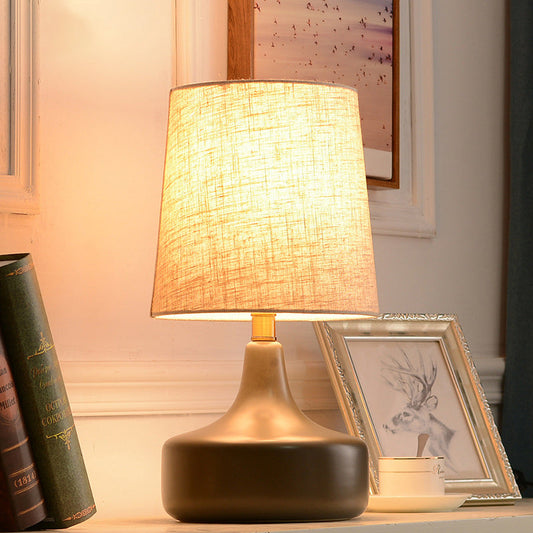Contemporary Scandinavian Brass Ceramic Fabric Tapered Cylindrical Shade 1-Light Table Lamp For Bedroom And Study