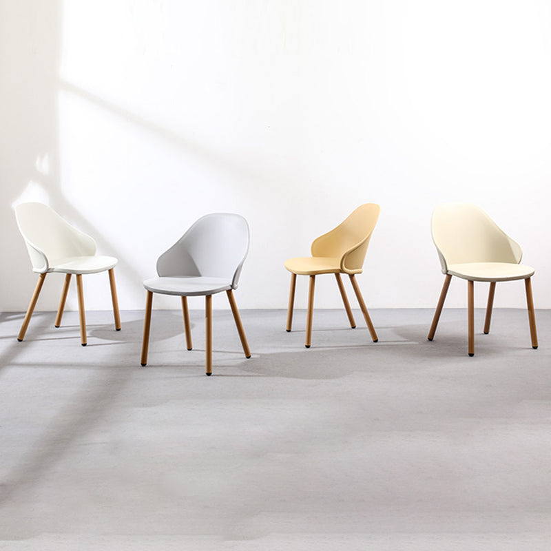 Contemporary Scandinavian Sleek Backrest Plastic Dining Chair With Solid Wood Legs For Dining Room