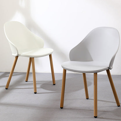 Contemporary Scandinavian Sleek Backrest Plastic Dining Chair With Solid Wood Legs For Dining Room
