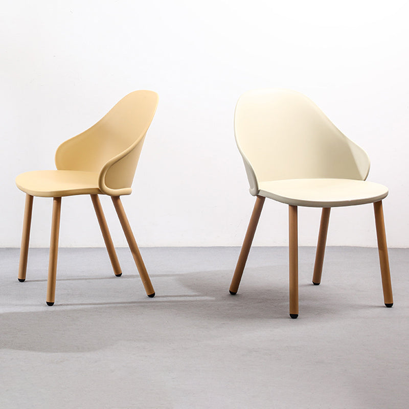 Contemporary Scandinavian Sleek Backrest Plastic Dining Chair With Solid Wood Legs For Dining Room